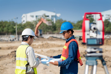 Construction engineer and foreman worker checking construction site for new Infrastructure construction project