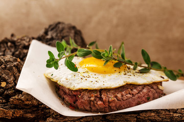 hamburger with fried egg and marjoram