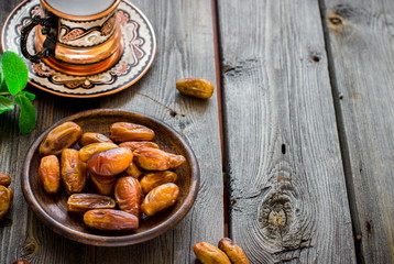 Tea with mint in arab style  on wooden table.