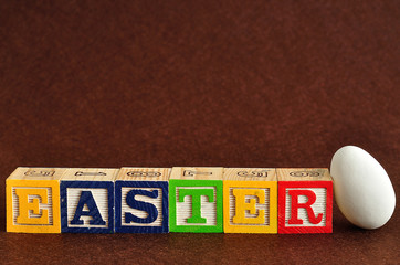 Easter spelled with alphabet blocks and a easter egg