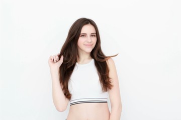 Fototapeta premium Young casual woman style isolated over white background. studio portrait,