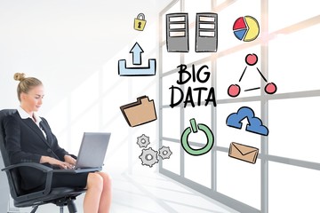 Businesswoman analyzing big data on laptop in office