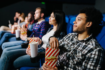 Group of mixed race friends at the movies