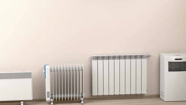 Different types of domestic electric heaters in the room