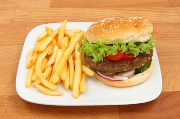 Burger and French fries on a table