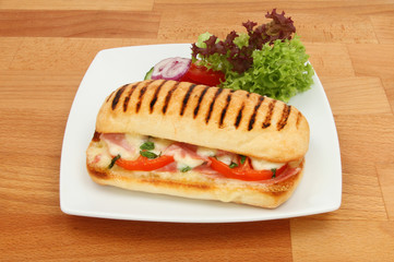 Pannini and salad on a worktop