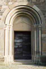 Fototapeta na wymiar old church door on a sunny morning