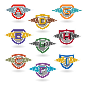 Set of letter badges with wings for logos, t-shirts, school or club crests. Letters a, b, c, d, e, f, g, h, i.