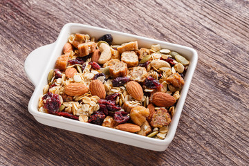 Granola or muesli in ceramic bowl