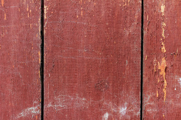 Red old wooden planks with cracks, top view background.