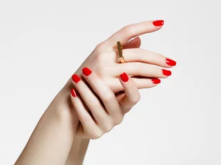Beauty delicate hands with manicure close up. Beautiful female fingers with manicure and fashionable gold ring. Beautiful nails close-up, great idea for the advertising of cosmetics