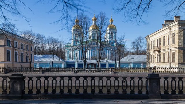 St. Nicholas Naval Cathedral and the Griboyedov Canal Embankment in spring sunny day with blue sky, Saint-Petersburg, Russia.