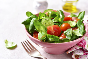 Vegetable salad with mix leaves,tomato and cucumber.
