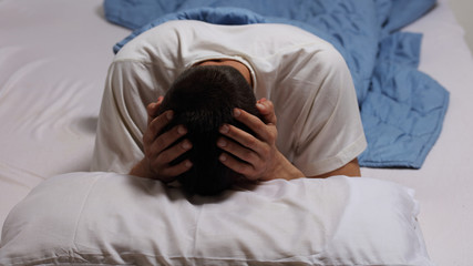 Sleep Disorders and Problems. Man struggling with insomnia.