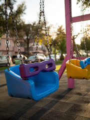 Colorful swing set at playground in a park