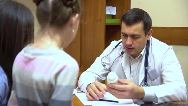 A young mother with a child to the doctor.