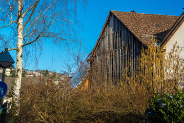 Old Barn In Town On A Blue Sky Day