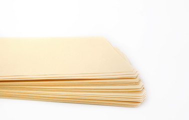 Stack of new manila office folders. Isolated.