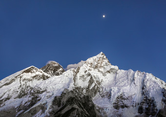 Moon over Mount Everest and Nuptse at sunset (view from Kala Patthar) - Nepal, Himalayas