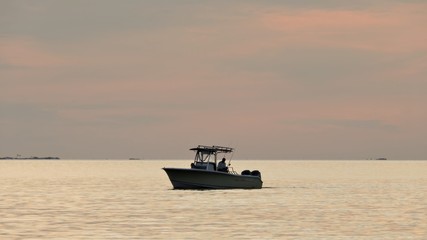 fishing under sunset skies