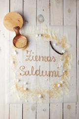 latin inscription of ziemos saldumi made of cream and decorated with cane sugar and powdered sugar