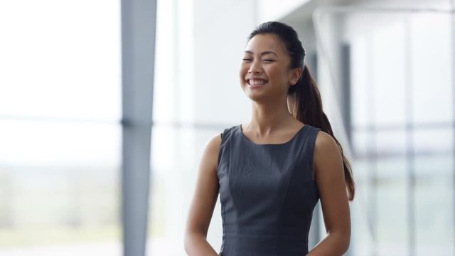  Portrait smiling businesswoman shaking hands with clients at end of meeting