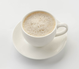 Coffee cup and saucer on a white background.