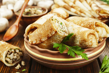 Crepes stuffed with chicken and mushrooms