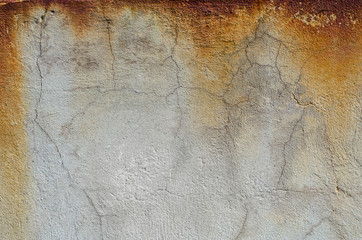 Rust on the gray concrete wall. Texture.