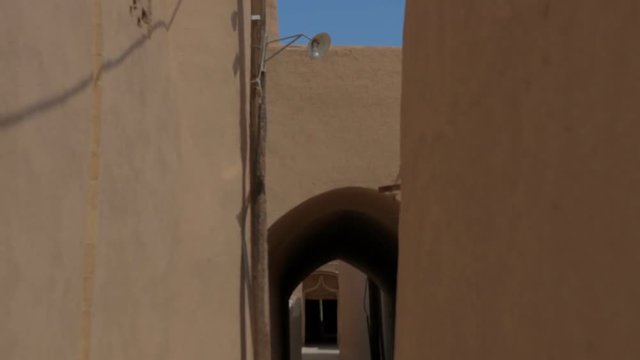 street of the old city in the Iranian province, walls of constructions are plastered by clay