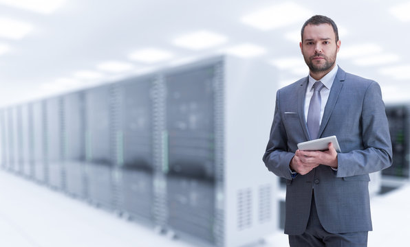 Young businessman in server room