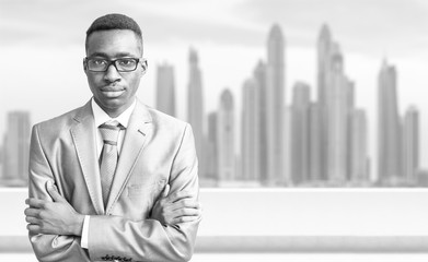 Fototapeta premium Young black businessman in front of the big city