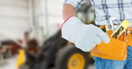 builder with his tools with blurred background