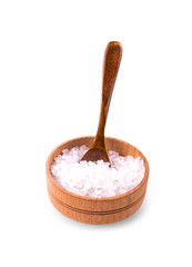 White bath salt in a wooden cup with a spoon.