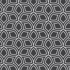 Vector seamless pattern. Monochrome graphic design. Decorative geometric leaves. Regular floral background with elegant petals. Modern stylish ornament.