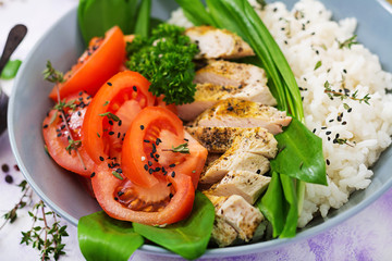 Healthy salad with chicken, tomatoes, wild garlic and rice. Proper nutrition. Dietary menu.