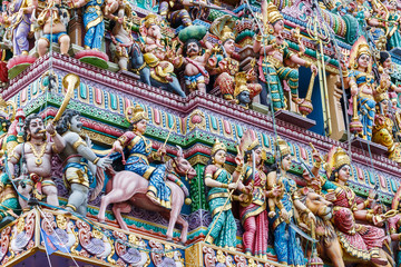 Fototapeta premium Intricate Hindu art and deity carvings on the facade of Sri Veeramakaliamman Temple in Little India, Singapore.