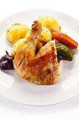 Roast chicken leg with potatoes