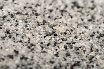 natural white with black marble stone chips macro background
