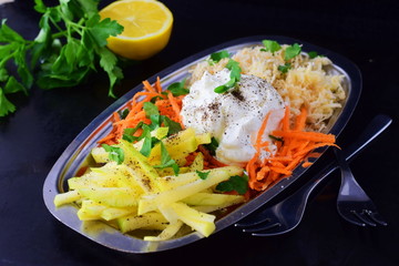 Fresh salad with celery, apple, carrot with yogurt on a metal plate on a grey background. Healthy eating concept. Dieting
