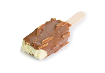 ice cream covered with chocolate and almonds on white background