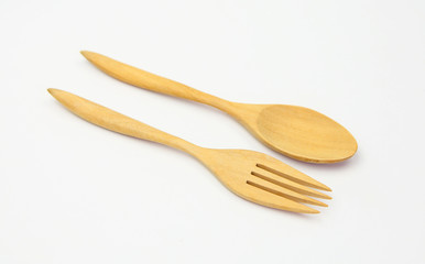 wooden spoon and fork on white background