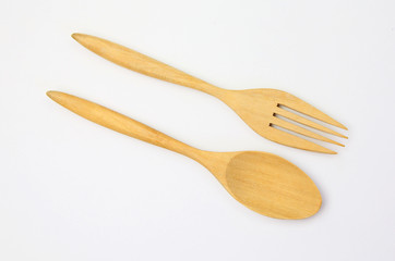 wooden spoon and fork on white background