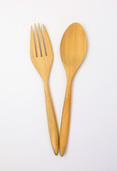 wooden spoon and fork on white background
