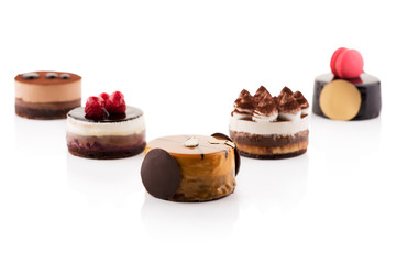 Sweet and tasty chocolate cakes on the white background.