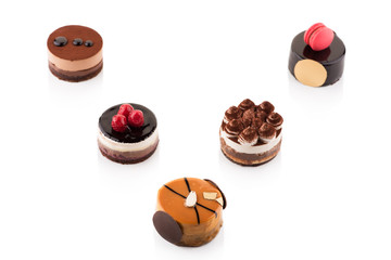 Sweet and tasty chocolate cakes on the white background.