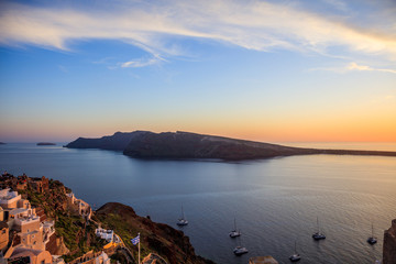 Fototapeta premium Santorini island, Greece - Caldera over Aegean sea at sunset