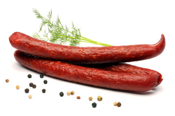 sliced red salami isolated on white background