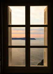 Beautiful sunset over sea water - window view