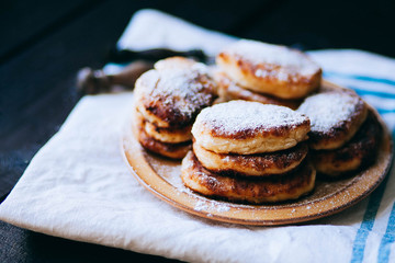 Curd cheese pancakes on the plate on white background. Studio Photo